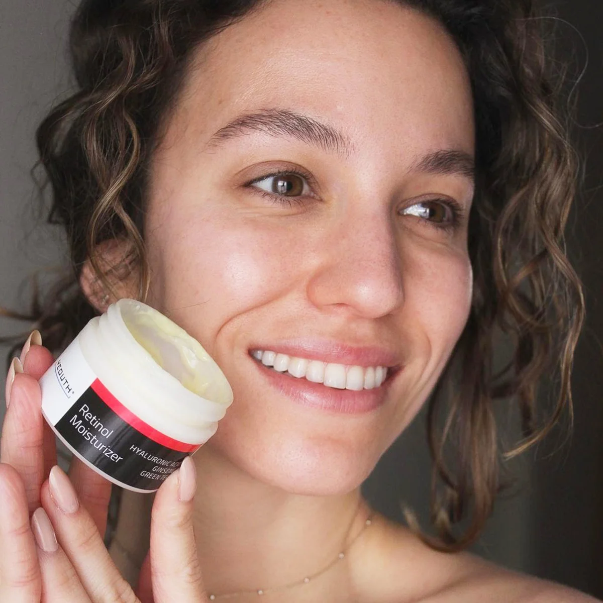 Customer showcasing Retinol Moisturizer results